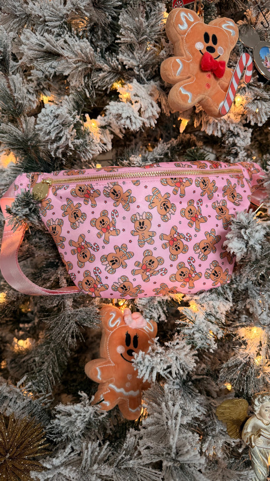 Pink pouch with gingerbread pattern on a decorated Christmas tree
