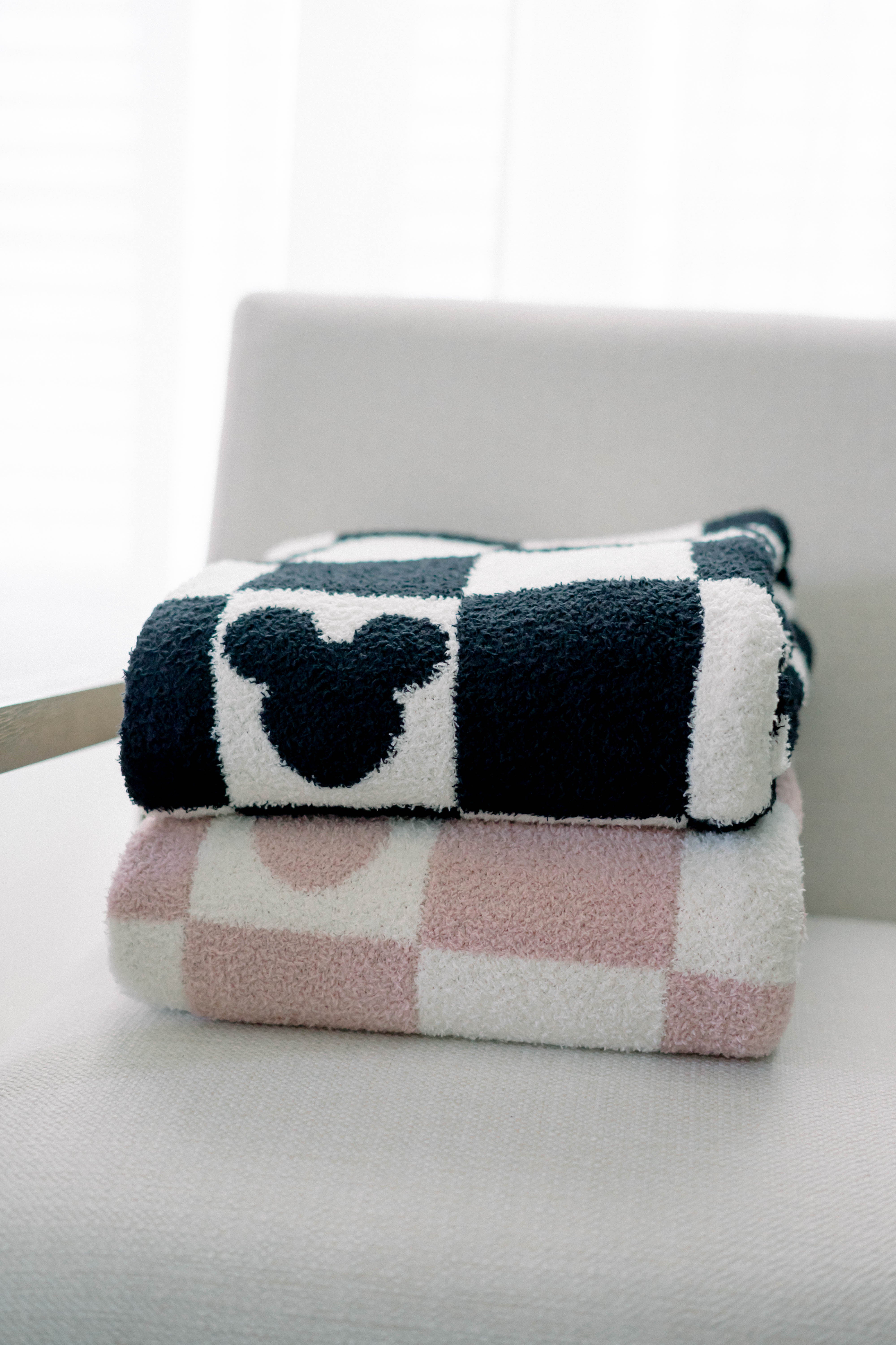 Checkered blanket with a Mickey Mouse design on a white surface