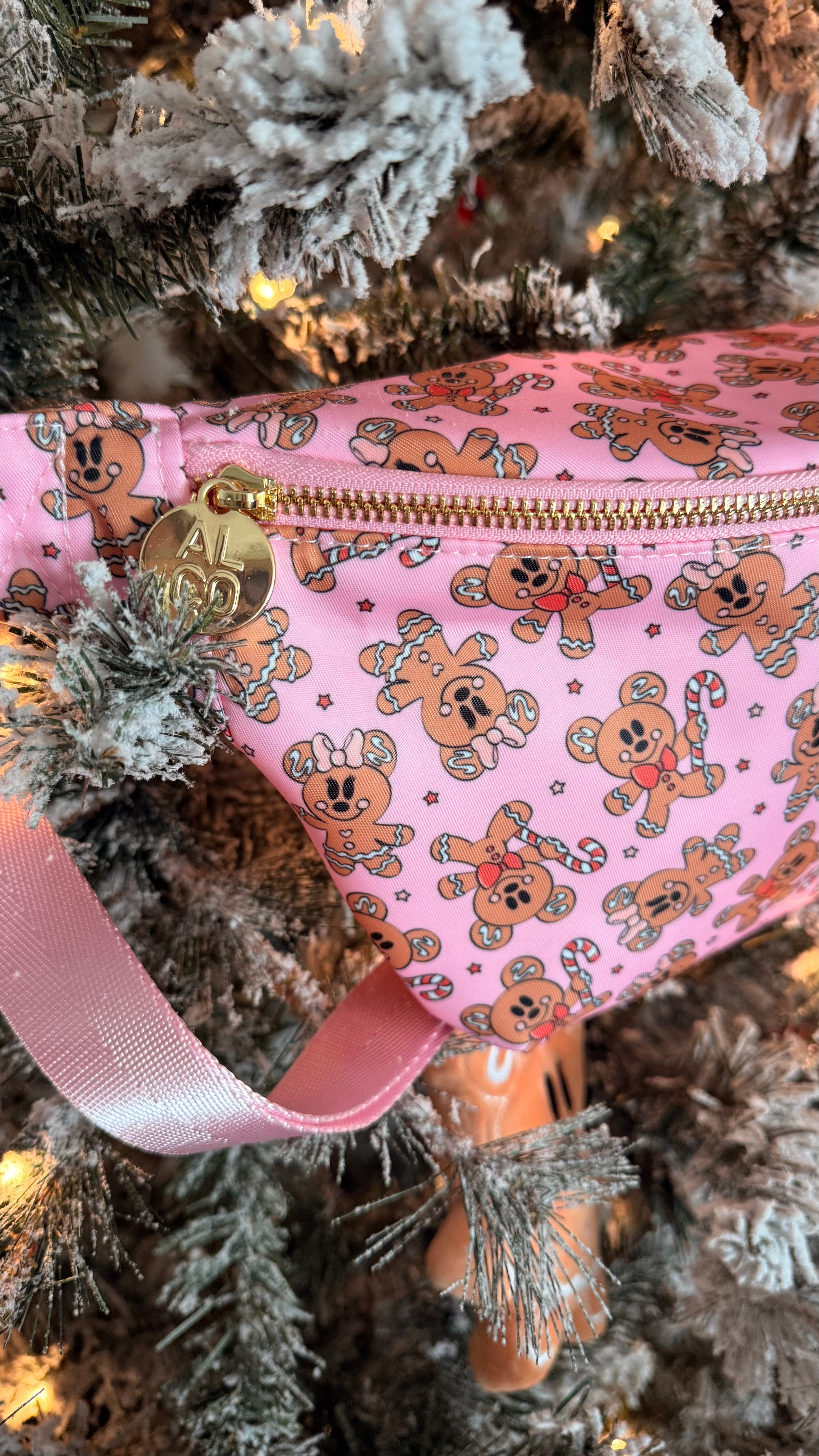 Pink fanny pack with teddy bear pattern on a Christmas tree